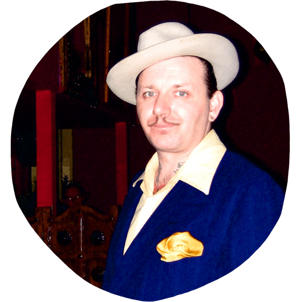 Ronnie King wearing a suit and hat