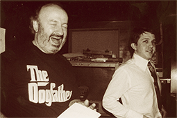 PY wears a T-shirt that says ‘The Dogfather’. Jean-Paul wears a high-collared shirt with dark tie.